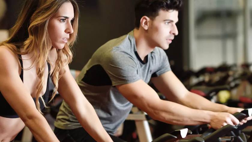 a man and woman on treadmill