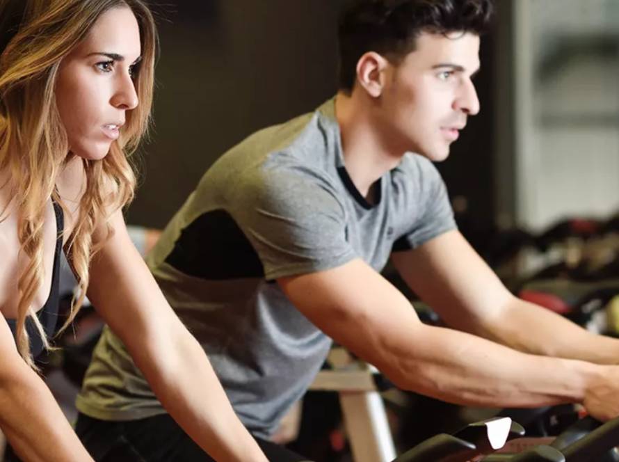 a man and woman on treadmill