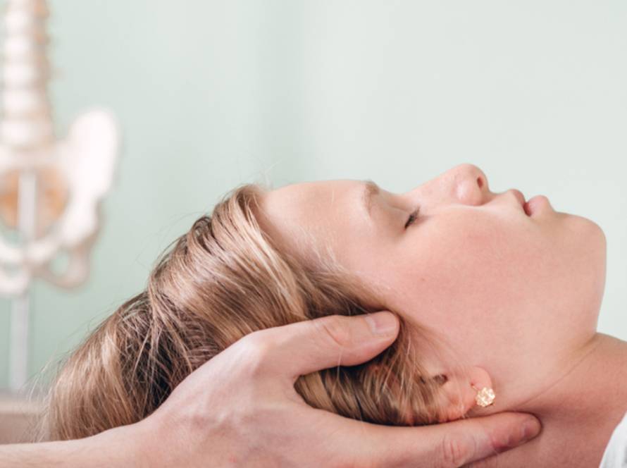A woman receiving a neck massage