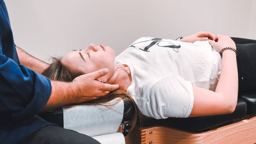 A person lying on a massage table